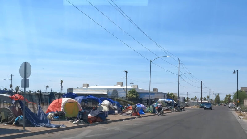 Homeless individuals sleeping in tents on the streets of Phoenix