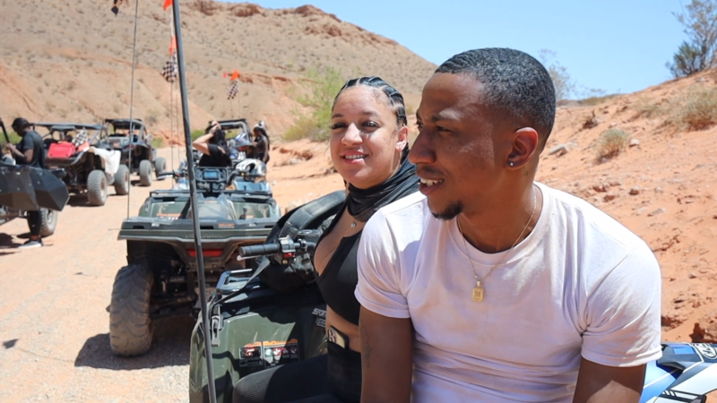 A Couple Sits on An ATV During an Off-Road Dune Tour in The Desert Near Las Vegas