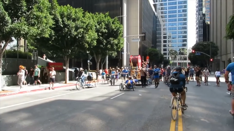 Diverse Crowd of All Ages Biking and Walking on A Car-Free Street During an Event in Downtown Los Angeles