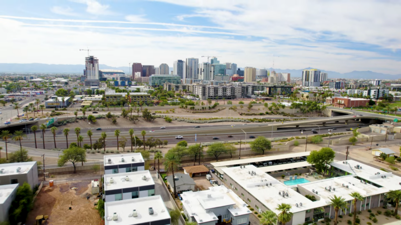 An Aerial View of Arizona's Urban Landscape, Featuring Modern High-Rise Buildings, Residential Areas, and Highways, Reflecting the State's Population Growth and Urban Development