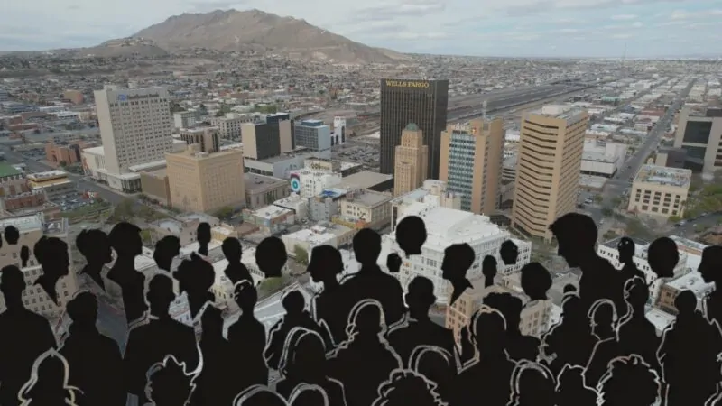 Aerial View of Downtown El Paso with A Silhouette Crowd in The Foreground, Representing the El Paso Population