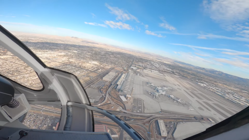 Aerial View of Las Vegas from A Helicopter, Showcasing the Vast Cityscape, Airport, and Desert Landscape