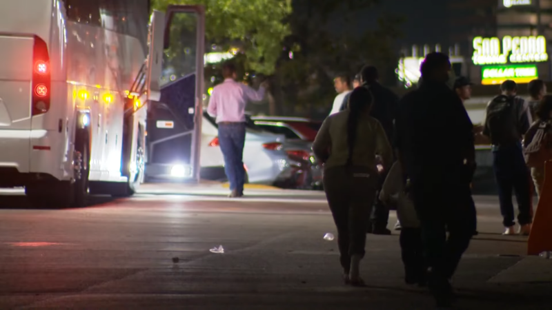 Night Scene Showing People Boarding a Bus in San Antonio 