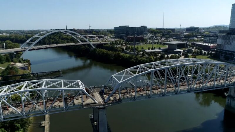 Aerial View of Bridges Over the Cumberland River in Nashville, Highlighting Infrastructure Development Amid the City's Projected Population Growth and Its Economic and Social Impacts