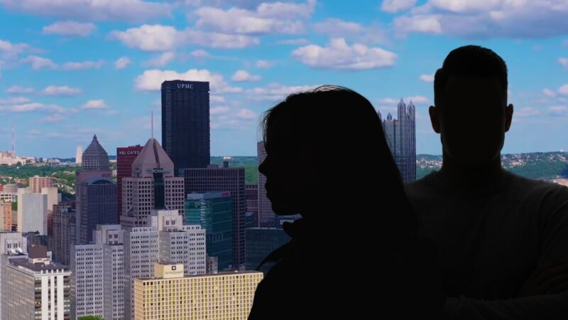 A Silhouette of A Couple Overlooking the Cityscape of Pittsburgh, Illustrating the Urban Density Relevant to Discussions on Pittsburgh Population