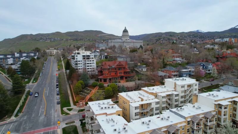 Aerial View of Utah's Urban Landscape, Featuring a Mix of Historic and Modern Buildings with The State Capitol in The Background, Symbolizing the State's Population Growth and Development in 2024