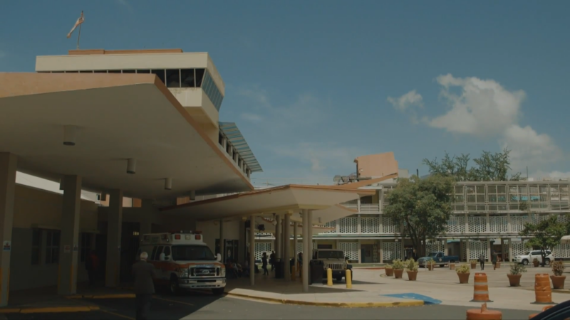 A Hospital Entrance with An Ambulance Parked Outside in Puerto Rico