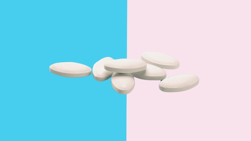 A Statin Pills Are Placed on A Blue and Pink Background