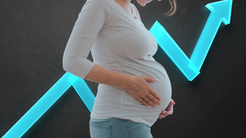 A Pregnant Woman Standing in Front of An Upward Arrow, Representing the Highest Population Growth Rates in The United States