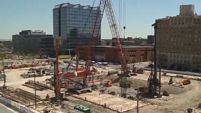 Construction Site in Omaha Showcasing Cranes and Heavy Machinery with Modern Buildings in The Background