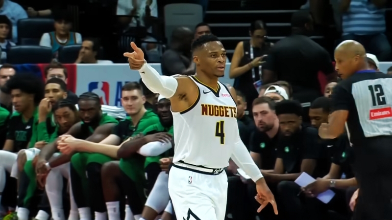 A Denver Nuggets Player, in Jersey Number 4, Gestures on The Court During a Game