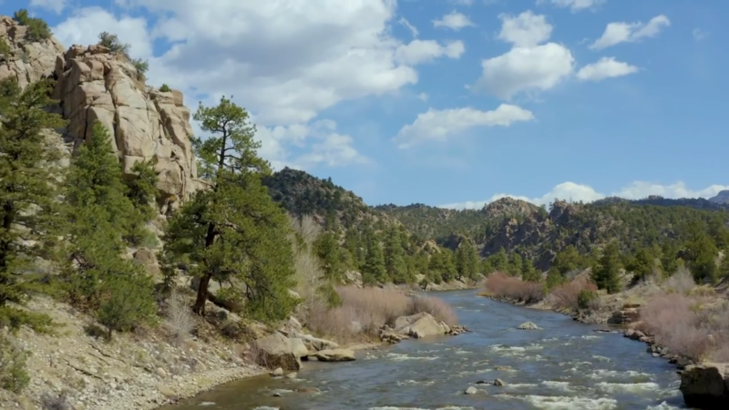 The Arkansas River Flows Through a Rocky Forested Valley in Colorado