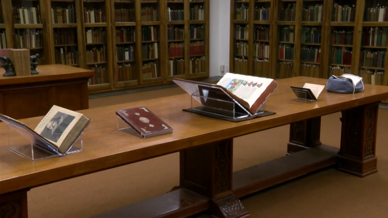 A Display of Rare Books and Manuscripts on A Wooden Table Inside the Harry Ransom Center in Austin, Texas