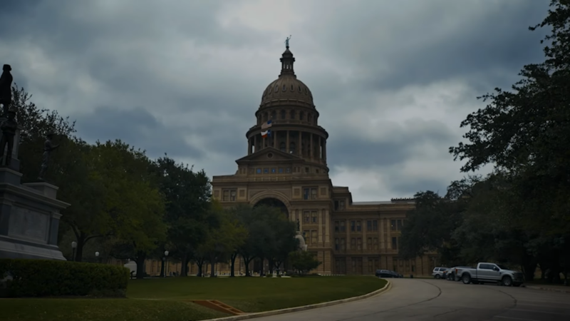 The Texas State Capitol Building with Trees and Lawn Around It