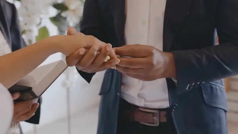 A Couple Exchanging Rings, Symbolizing the Risks of Marrying Too Young