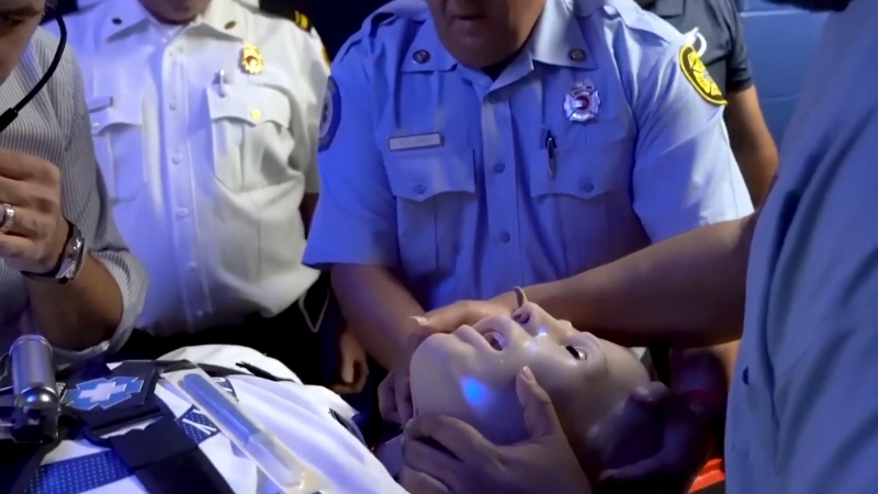 Medical Professionals Practicing Emergency Procedures Using a High-Tech Simulation Mannequin During a Training Session in North America