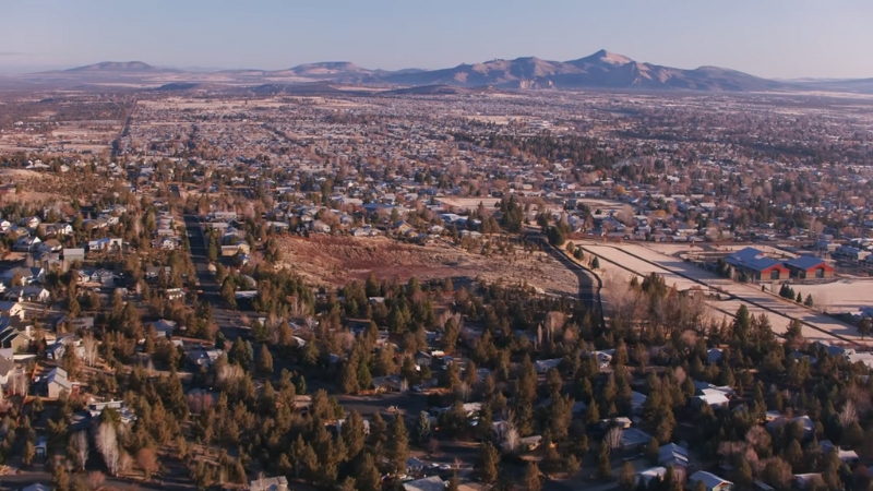 Oregon’s Population Is Growing, with Expanding Suburban Neighborhoods Against the Backdrop of Distant Mountains