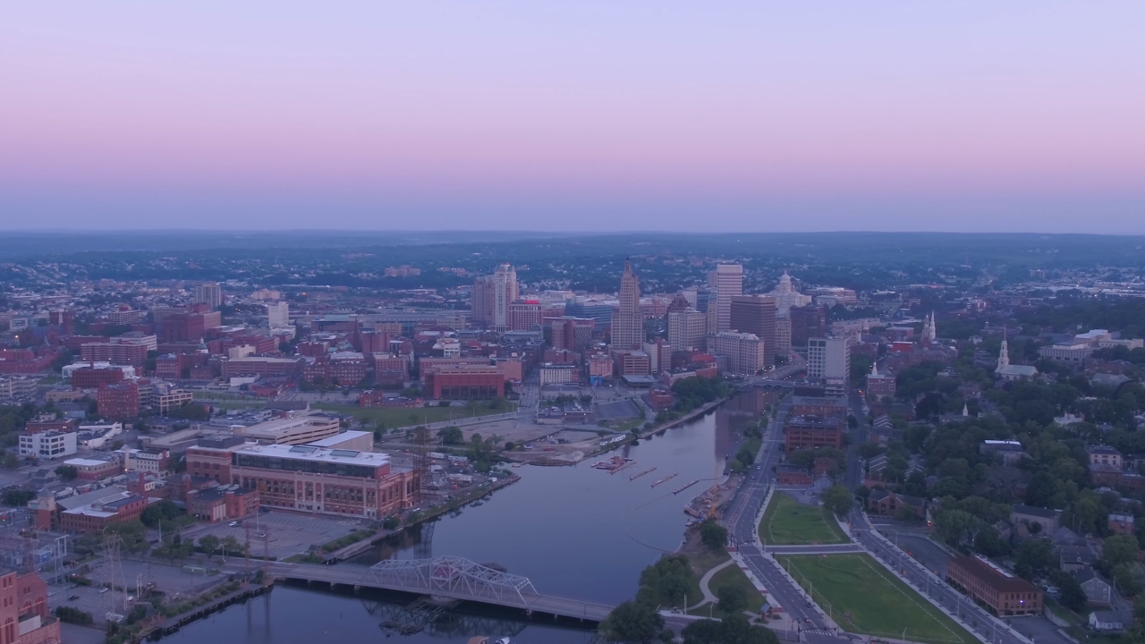 Providence skyline sits beside the river at dusk