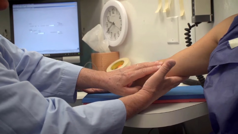 A Healthcare Professional Conducts a Medical Examination as Part of NHANES Research