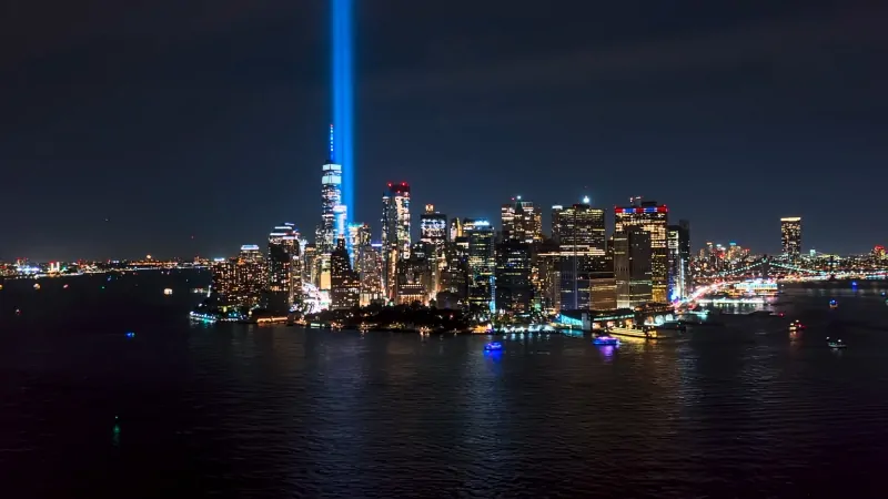 New York City Skyline Illuminated at Night, Reflecting the Scale of The New York City Population