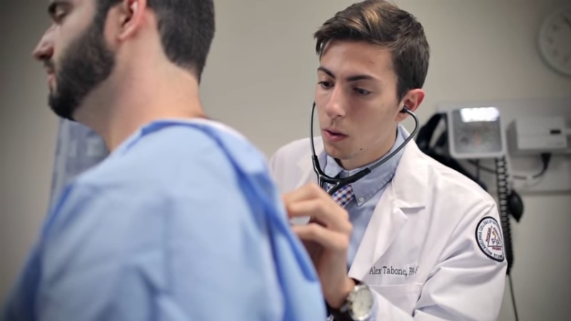 A Physician Assistant (PA) Examining a Patient Using a Stethoscope in A Clinical Setting