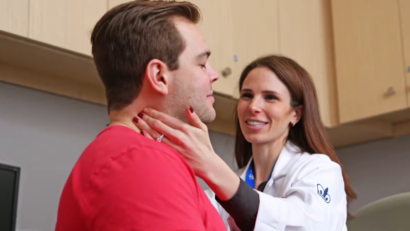 A Speech-Language Pathologist (SLP) Working with A Patient in A Clinical Setting