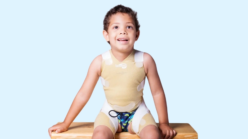 A Child Wearing TheraTogs, Designed to Support Postural Correction and Improve Movement During Therapy