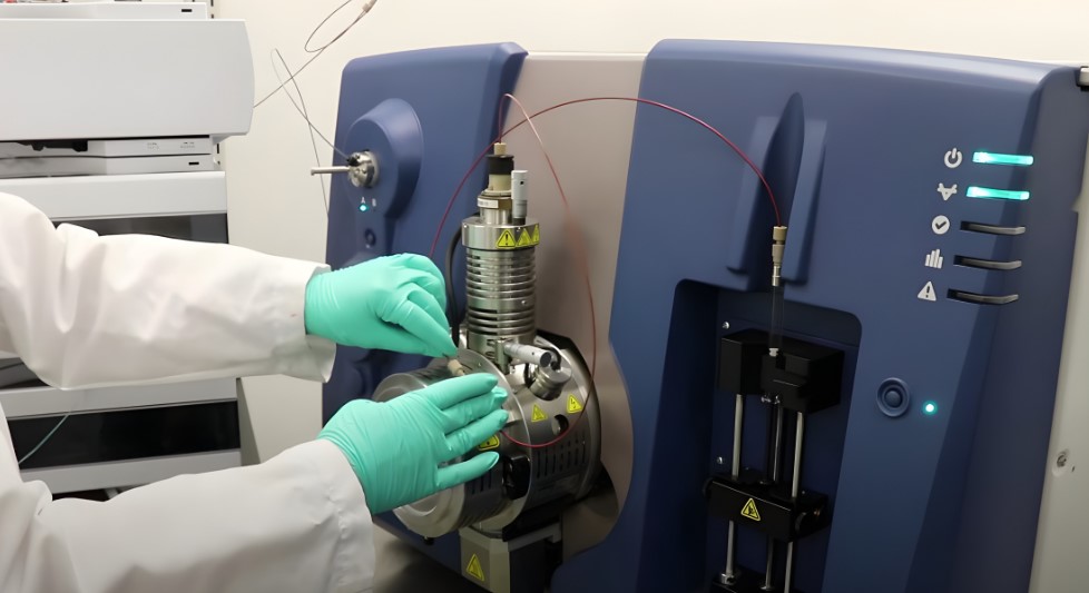 A scientist meticulously adjusts components of a high-performance liquid chromatography (HPLC) system