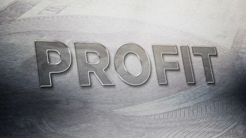 Close-up of the word 'PROFIT' overlaid on a background of money