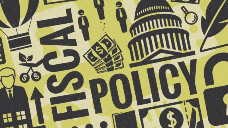 Illustration of various fiscal and policy-related symbols, including money, government buildings, and financial graphs