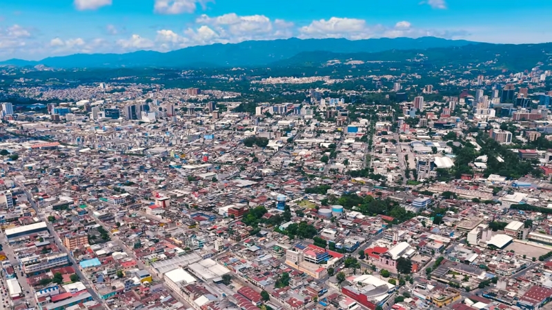 The image shows an aerial view of Guatemala City
