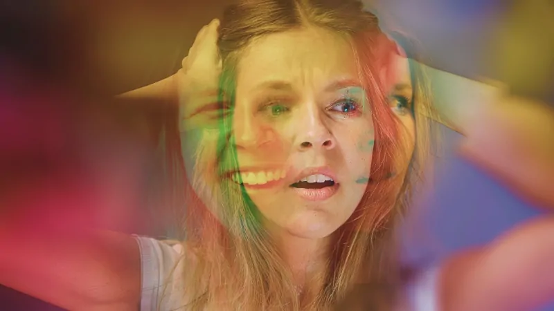 A woman showing distress, representing impulse control disorders