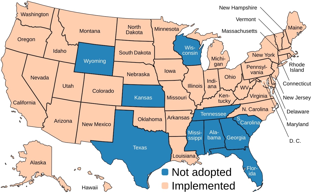 United States map showing Medicaid expansion status by state. States in light orange have implemented expansion, while states in blue have not adopted it