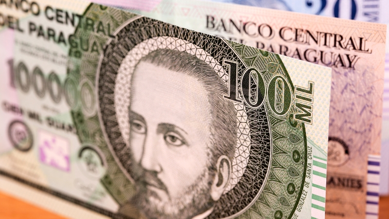 Close-up of high-denomination Paraguayan Guarani banknotes highlighting its place among the world’s lowest-value currencies