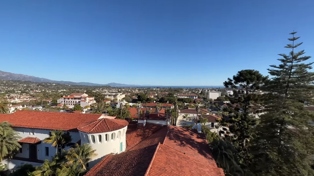 Rooftop view of red-tiled buildings in Santa Barbara with coastline in the distance, one of the top US cities to visit in 2025