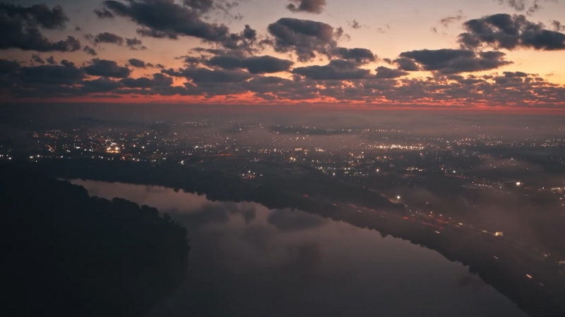 City view at dusk representing destinations where tourists outnumber locals