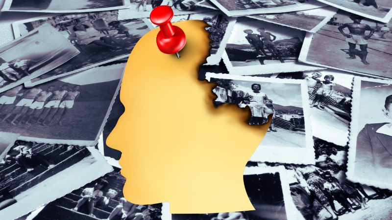 Silhouette of a head with a missing puzzle piece pinned on top, surrounded by old photos, symbolizing the concept of eidetic memory