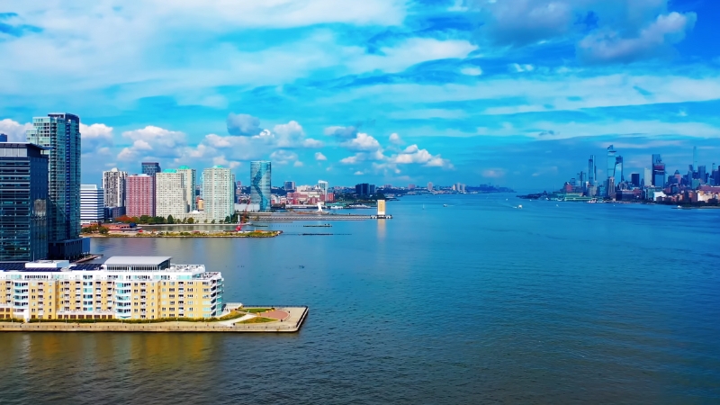 Aerial view of Jersey City waterfront with the Hudson River and Manhattan skyline in the background