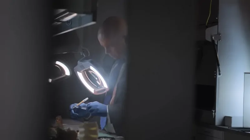 A researcher works with lab equipment to create 3D-printed personalized medical solutions