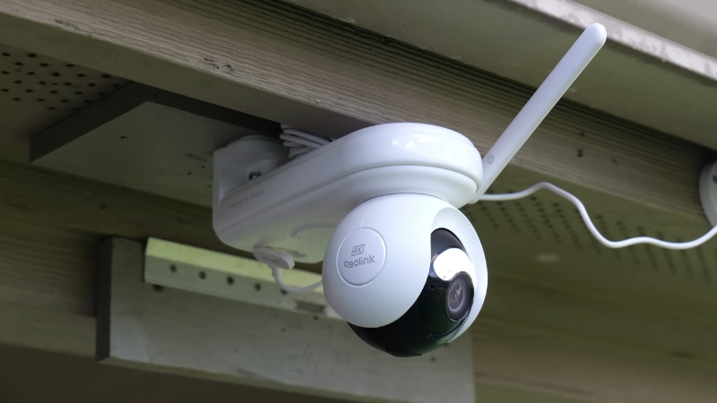 A smart outdoor security camera mounted under a roof
