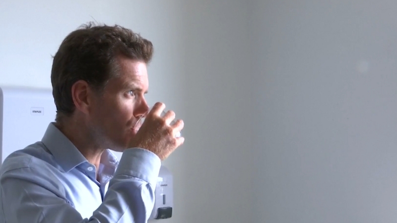 Man drinking water, showing how microplastics can enter the body