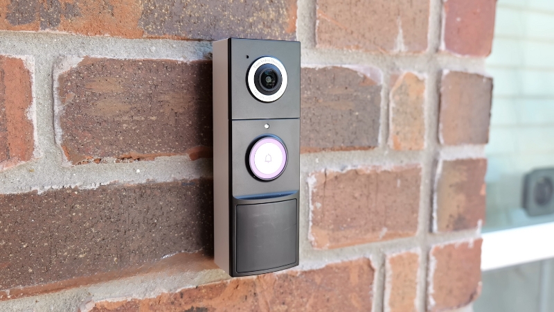 A smart video doorbell mounted on a brick wall represents the growing demand in the smart home safety market