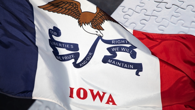 Iowa state flag displayed with its eagle emblem and motto