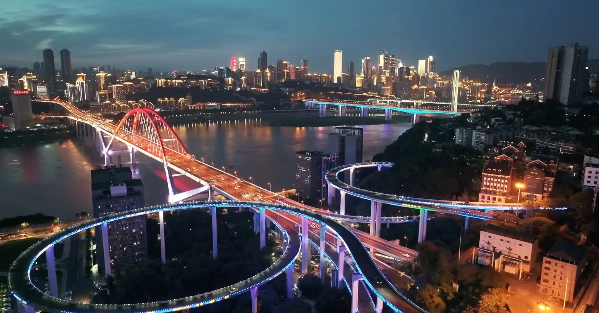 A night view of Chongqing’s layered highways and bridges lit over the river in the world’s largest city