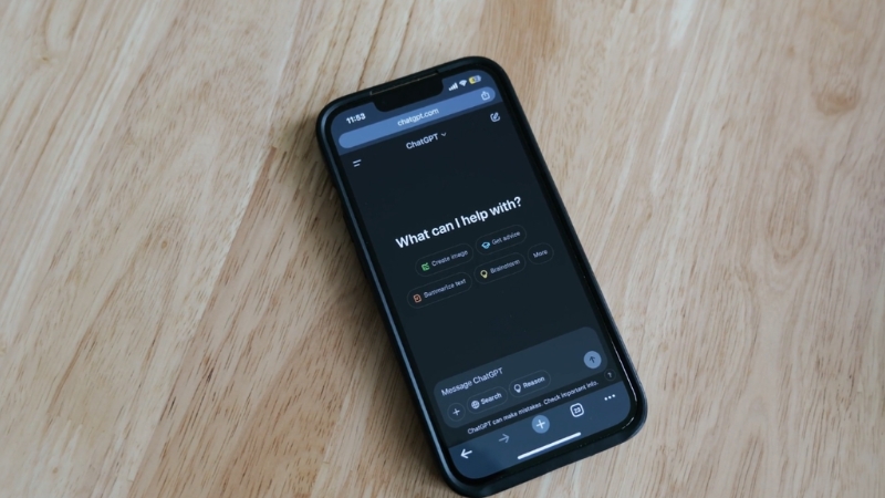Smartphone on a table open to an AI chatbot app interface