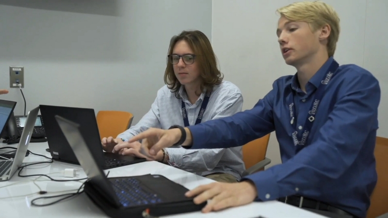 Students collaborate at Bentonville Ignite while working on a real-world project using laptops