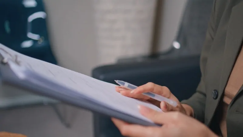 Person review paperwork related to Vermont health insurance rules without a penalty