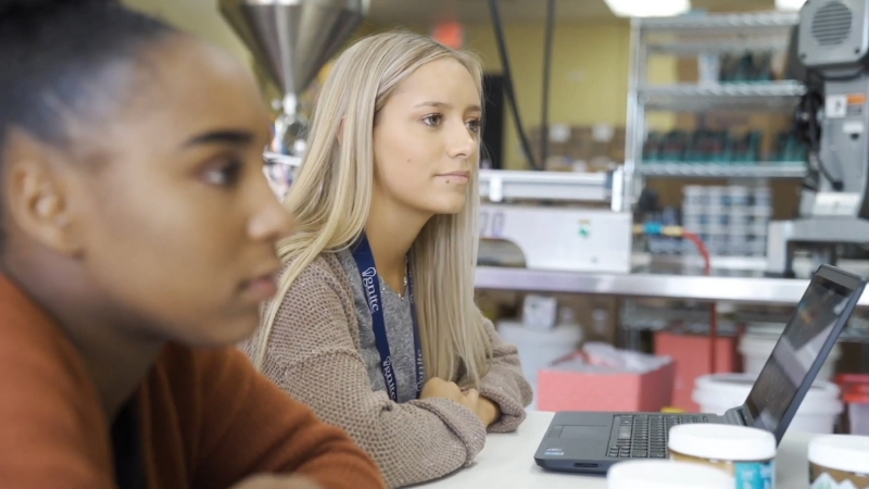 Students at Bentonville Ignite work on laptops during a hands-on class focused on real-world projects