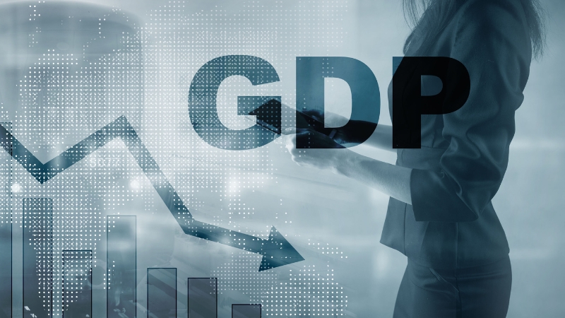 Person holding a tablet in front of a chart and large GDP text, representing economic performance beyond GDP per capita