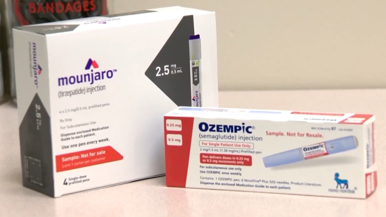 Ozempic and GLP-1 medications in injection pen boxes displayed on a pharmacy counter